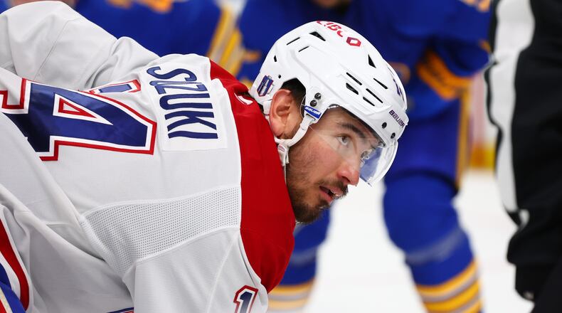 Montreal Canadiens center Nick Suzuki lines up for a face-off during the second period in Game 5 of a second-round NHL hockey Stanley Cup playoff series against the Buffalo Sabres, Thursday, May 14, 2026, in Buffalo, N.Y. (AP Photo/Jeffrey T. Barnes)