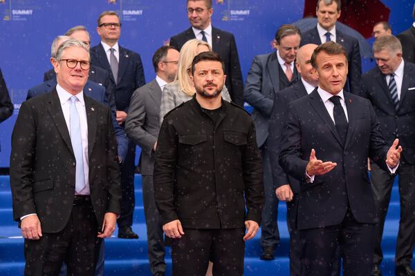 Britain's Prime Minister Keir Starmer, left, Ukraine's President Volodymyr Zelenskyy and France's President Emmanuel Macron, right, during a group photo at the beginning of a summit where the leaders of 47 European countries and organizations will discuss security, defense and democratic standards, in Tirana, Albania, Friday, May 16, 2025. (Leon Neal/Pool via AP)