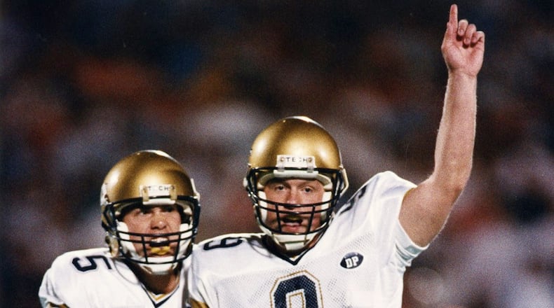 Georgia Tech kicker Scott Sisson (9) and holder Scott Aldredge (5) celebrate Sisson’s game winning field goal over Virginia to win 41-38 on November 3, 1990. Frank Niemeir / AJC