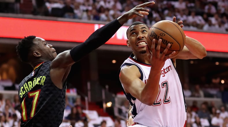 WASHINGTON, DC - APRIL 16: Otto Porter Jr. #22 of the Washington Wizards puts up a shot in front of Dennis Schroder #17 of the Atlanta Hawks in the first half in Game One of the Eastern Conference Quarterfinals during the 2017 NBA Playoffs at Verizon Center on April 16, 2017 in Washington, DC. (Photo by Rob Carr/Getty Images)