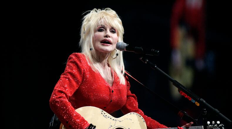 FILE - Dolly Parton performs at a United Way of America convention in Detroit, Friday, May 15, 2009. (AP Photo/Carlos Osorio, File)