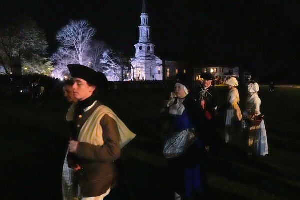 Colonials gather prior to facing the British Regulars during a reenactment celebration of the 250th anniversary of the Battle of Lexington and start of the American Revolution, Saturday, April 19, 2025, in Lexington, Mass. (AP Photo/Charles Krupa)