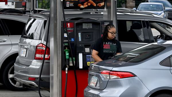 A customer fills up at a gas station on Northside Drive on Tuesday, July 14, 2026, in Atlanta. (Hyosub Shin/AJC)