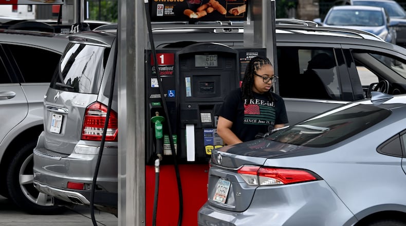 Customers fill up fuel tanks at a QuikTrip station on Northside Drive on Tuesday, July 14, 2026, in Atlanta. (Hyosub Shin/AJC)