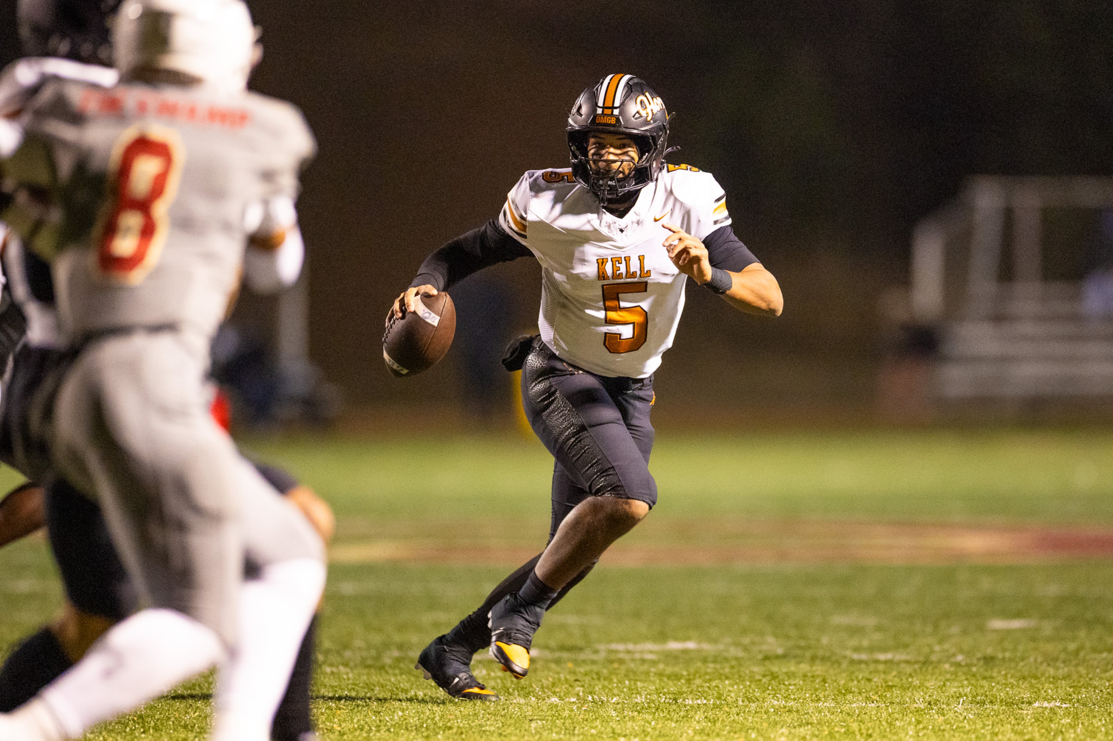 Kell quarterback Kaleb Narcisse (5) runs with the ball during the second half of the class 4A semifinal against Creekside at Creekside High School in Fairburn, GA on Friday, December 5, 2025. (Oscar Guevara Saenz for the AJC)