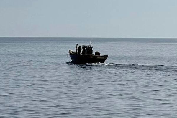 In this photo provided by South Korea Unification Ministry, a wooden boat carrying North Korean individuals move northward in the East Sea, South Korea, as South Korea sent the North Koreans back across their sea border, Wednesday, July 9, 2025. (South Korea Unification Ministry via AP)