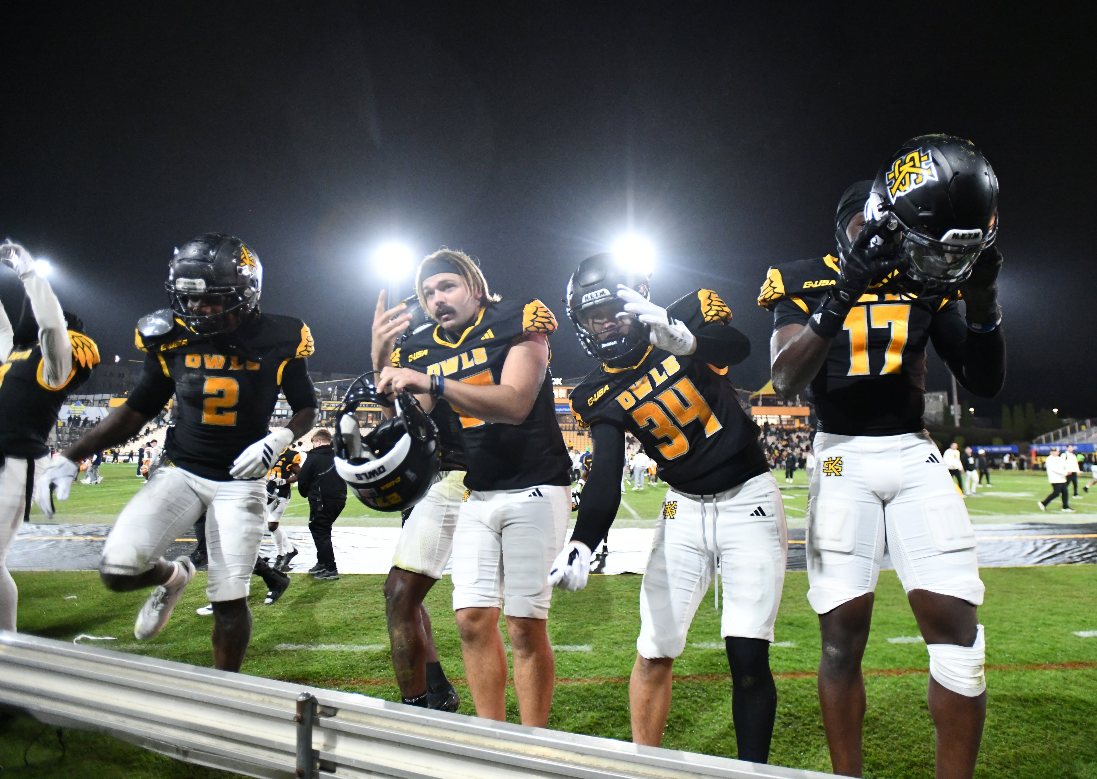 Kennesaw State players celebrate after Kennesaw State beat UTEP during an NCAA college football game at Fifth Third Stadium, Tuesday, October 28, 2025 in Kennesaw. Kennesaw State won 33-20 over University of Texas at El Paso. (Hyosub Shin / AJC)
