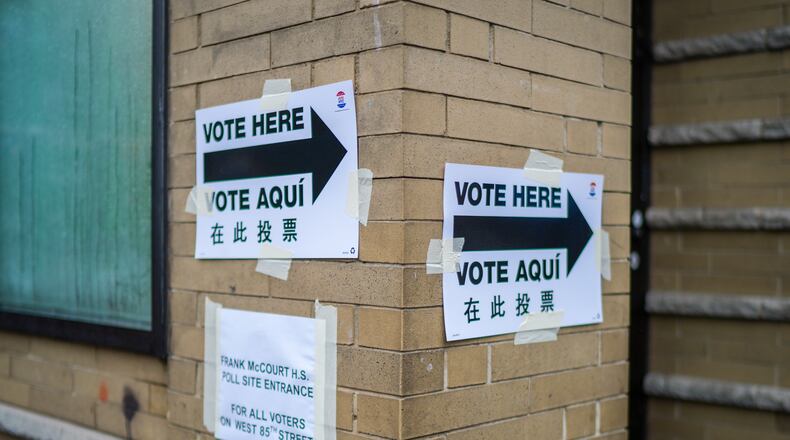 Voting signs are displayed outside a polling station on Election Day during New York’s primary election on Tuesday, June 23, 2026, in New York. (AP Photo/Ryan Murphy)