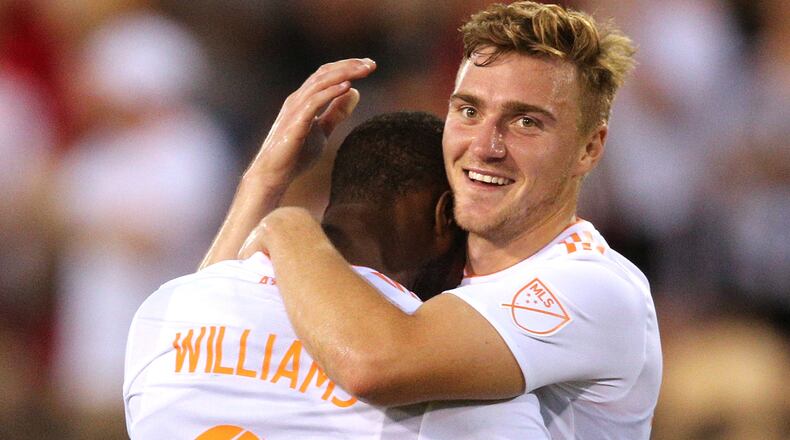 Atlanta United forward Romario Williams (left) celebrates his goal with midfielder Julian Gressel against Charleston Battery during the second half in a U.S. Open Cup match on Wednesday, June 6, 2018, in Kennesaw. Curtis Compton/ccompton@ajc.com