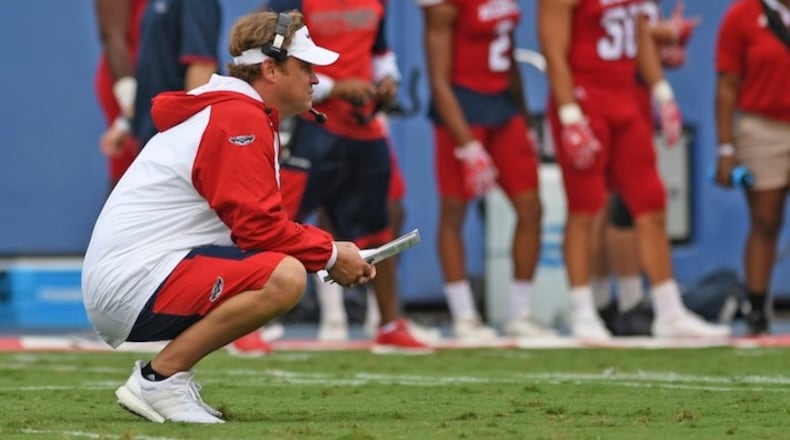 New Florida Atlantic coach Lane Kiffin watches players Saturday, April 22, 2017, in Boca Raton, Fla. Kiffin is at a school coming off three consecutive 3-9 seasons instead of being with a Crimson Tide program that will almost certainly find its way into the national-title conversation again this year. And while Alabama was having its spring game before 74,326 people Saturday afternoon, Kiffin's Owls played simultaneously before barely anyone. None of that mattered to Kiffin. His first spring with the Owls is over, and he called it a success--plus had plenty of light-hearted perspective on the crowd, or lack thereof. ( Jim Rassol/South Florida Sun-Sentinel via AP)