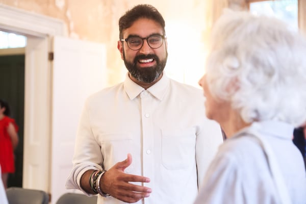 Rohit Malhotra, founder of the Center for Civic Innovation, speaks to community members during his meet and greet at the Atlanta Preservation Center on Tuesday, Aug. 12, 2025. (Abbey Cutrer/AJC)