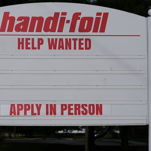 A help wanted sign is seen outside of a company in Wheeling, Ill., Monday, June 8, 2026. (AP Photo/Nam Y. Huh)