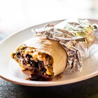 Raging Burrito on Decatur Square has been sold to new owners after 27 years. (Henri Hollis/AJC)