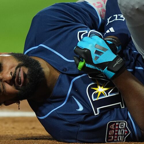 Tampa Bay Rays' Junior Caminero reacts after being hit by a pitch by St. Louis Cardinals' Riley O'Brien in the third inning of the MLB baseball All-Star Game between the American League and National League, Tuesday, July 14, 2026, in Philadelphia. (AP Photo/Matt Rourke)
