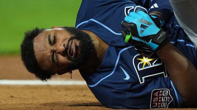 Tampa Bay Rays' Junior Caminero reacts after being hit by a pitch by St. Louis Cardinals' Riley O'Brien in the third inning of the MLB baseball All-Star Game between the American League and National League, Tuesday, July 14, 2026, in Philadelphia. (AP Photo/Matt Rourke)
