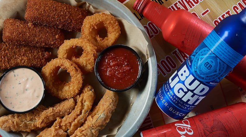 Get $2 pints of Budweiser or Budweiser Light and more NCAA tournament specials at Taco Mac today. HANDOUT / Melissa Libby & Associates.