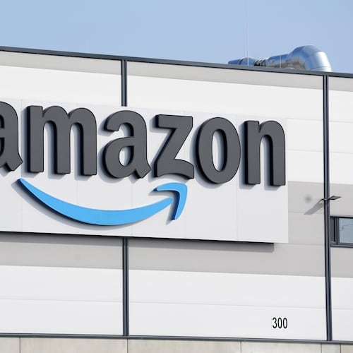 FILE - An Amazon company logo marks the facade of a building, March 18, 2022, in Schoenefeld near Berlin. (AP Photo/Michael Sohn, File)