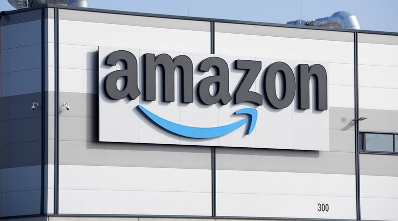 FILE - An Amazon company logo marks the facade of a building, March 18, 2022, in Schoenefeld near Berlin. (AP Photo/Michael Sohn, File)