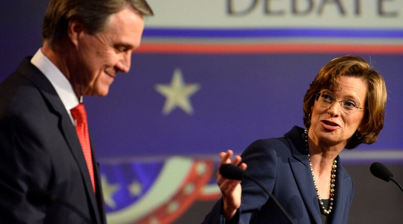 Georgia U.S. Senatorial candidates Republican David Perdue, left, and Democrat Michelle Nunn participate in a debate sponsored by the Atlanta Press Club at the Georgia Public Broadcasting studios Sunday, Oct. 26, 2014, in Atlanta. David Tulis / AJC Special