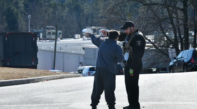 Hall County Deputy Sheriff directs a woman where they blocked off the entrance of the Foundation Food Group where six people were killed and several others were injured Thursday after a liquid nitrogen line ruptured in Gainesville in January 2021. (Hyosub Shin / Hyosub.Shin@ajc.com)