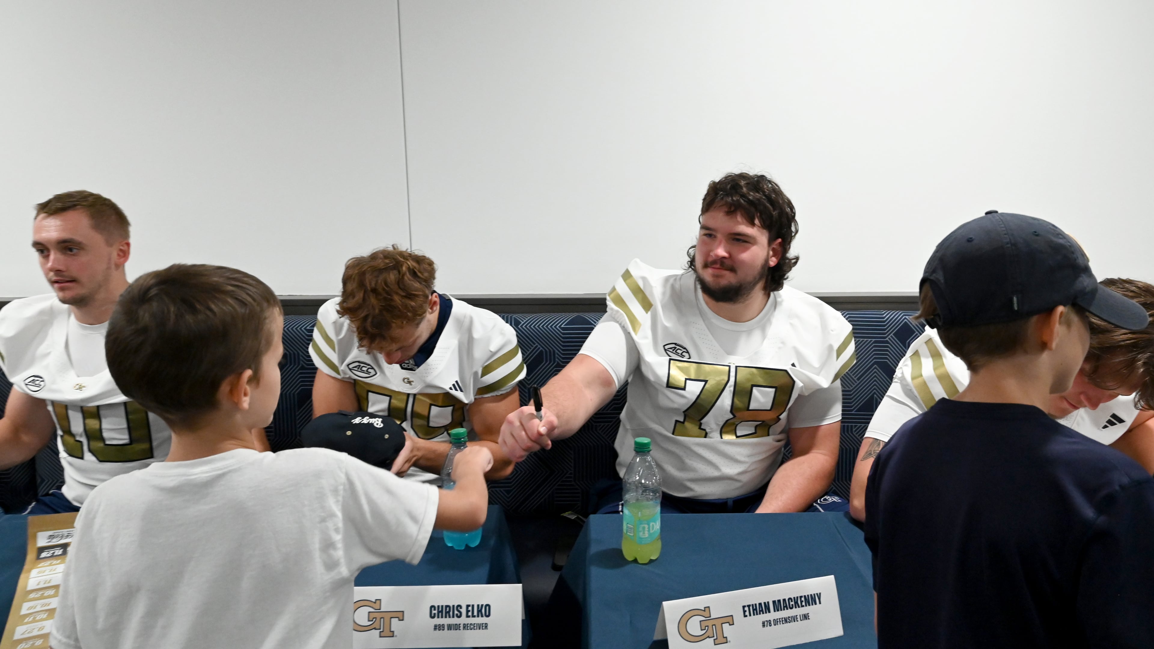 Georgia Tech offensive lineman Ethan Mackenny (78) fist-bumped a fan during the annual “First Saturday on The Flats” at Bobby Dodd Stadium, Saturday, August 2, 2025, in Atlanta. The event provided Tech fans with the opportunity to engage with their favorite Yellow Jackets ahead of the upcoming 2025 season. (Hyosub Shin/AJC)