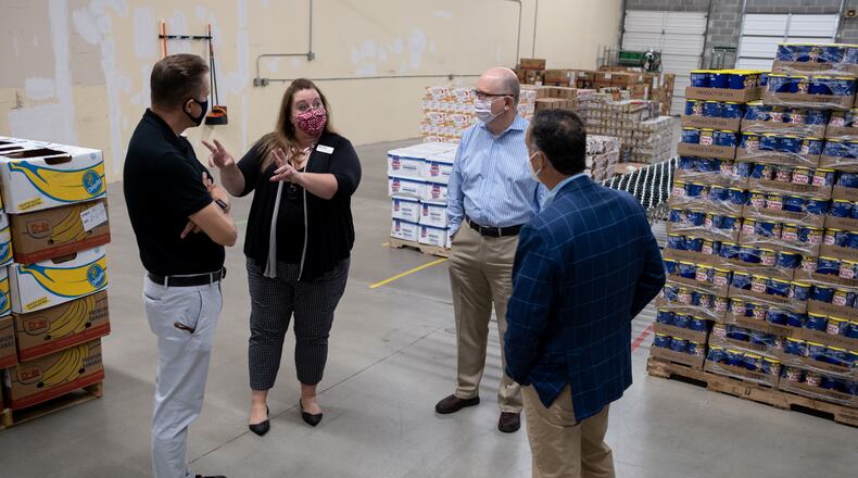 Cameron Turner, with the Atlanta Community Food Bank, gives a tour of their new Community Food Center in Stone Mountain on Thursday morning. Ben Gray for the Atlanta Journal-Constitution