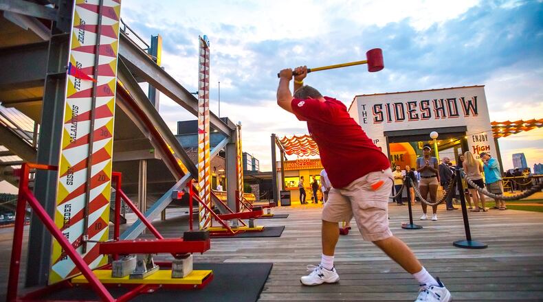 Skyline Park, on the roof of Ponce City Market, is the newest game in town with carnival games, cocktails, putt-putt, prizes, slides and rides. With a 10 dollar ticket access an original Sears Warehouse cargo elevator, learn a little history and enjoy a different view of the city. (Jenni Girtman / Atlanta Event Photography)