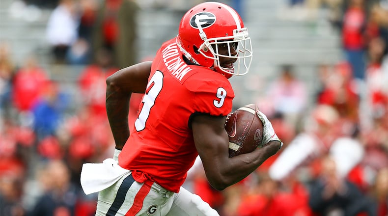 Georgia wide receiver Jeremiah Holloman (9) scores a touchdown during G-Day Saturday, April 20, 2019, at Sanford Stadium in Athens,.