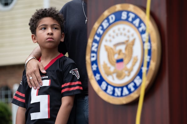 Dominic Parcel's dad, told those at the news conference he has been trying to buy a home for two years. (Ben Gray for the AJC)