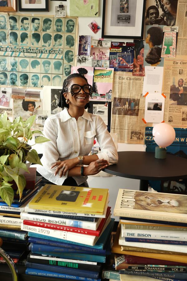 The walls of Archive CLT on Beatties Ford Road in Charlotte, N.C., offer a trip back in time and make the cozy room worth sticking around in. (Travis Dove for the AJC)