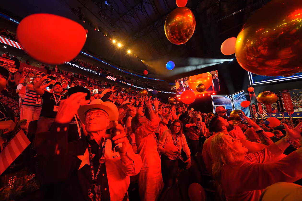 Attendees cheer at the end of the Republican midterm convention on Thursday in Dallas. (Julio Cortez/AP)
