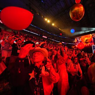 Attendees cheer at the end of the Republican midterm convention on Thursday in Dallas. (Julio Cortez/AP)