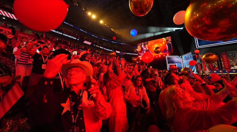 Attendees cheer at the end of the Republican midterm convention on Thursday in Dallas. (Julio Cortez/AP)