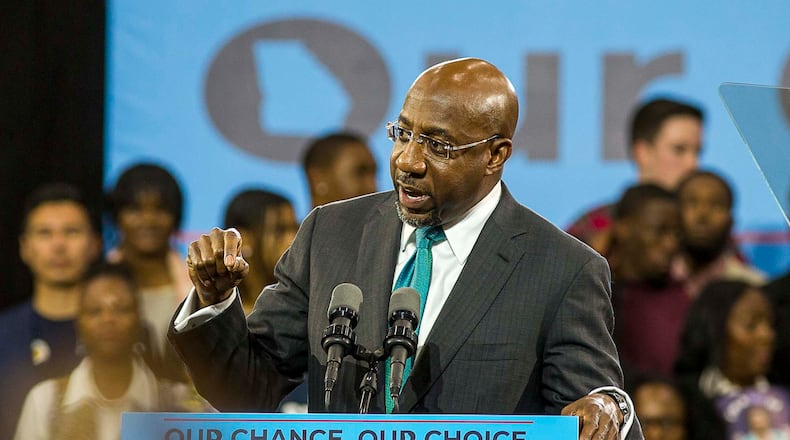 11/02/2018 -- Atlanta, Georgia -- Rev. Raphael G. Warnock, pastor of the historic Ebenezer Baptist Churchspeaks during a rally for gubernatorial candidate Stacey Abrams in Forbes Arena at Morehouse College, Friday, November 2, 2018.  (ALYSSA POINTER/ALYSSA.POINTER@AJC.COM)