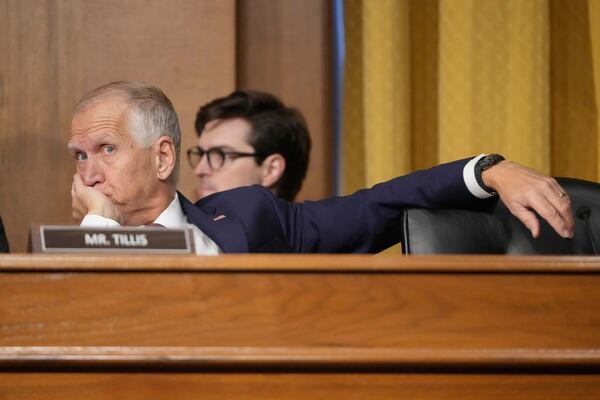 Sen. Thom Tillis, R-N.C., listens as U.S. Trade Representative Jamieson Greer as he testifies before the Senate Finance Committee on Capitol Hill in Washington, Tuesday, April 8, 2025. (AP Photo/Mark Schiefelbein)