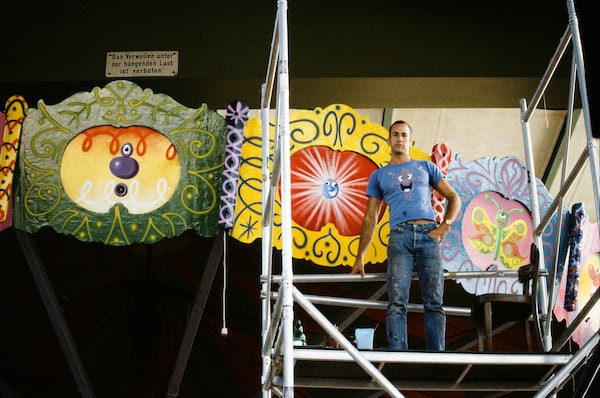 Kenny Scharf works on his painted chair swing ride for "Luna Luna" in 1986-1987. (Kenny Scharf/Licensed by Artestar, New York. Courtesy of Sabina Sarnitz/Luna Luna, LLC)
