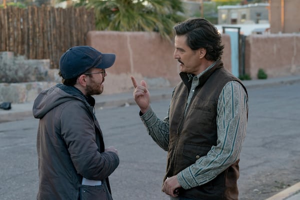 This image released by A24 shows director Ari Aster, left, and Pedro Pascal filming "Eddington." (Richard Foreman/A24 via AP)