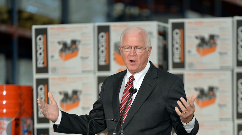 October 8, 2014 Locust Grove - Senator Saxby Chambliss speaks during a cost-sharing agreement event for the Savannah Harbor Expansion Project at Home Depot Direct Fulfillment Center on Wednesday, October 8, 2014. Gov. Nathan Deal announced that the U.S. Army Corps of Engineers, the Georgia Department of Transportation and the Georgia Ports Authority have signed a cost-sharing agreement for the Savannah Harbor Expansion Project, meaning dredging in the river could begin by the end of the year. HYOSUB SHIN / HSHIN@AJC.COM Saxby Chambliss speaks in Locust Grove in October. (AJC/Hyosub Shin)