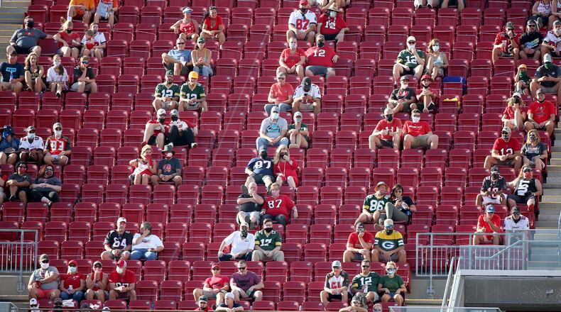 Fans are socially distanced in the 300 level during the first quarter of the game between the Green Bay Packers at Buccaneers and the Tampa Bay Buccaneers on Sunday, Oct. 18, 2020, at Raymond James Stadium in Tampa, Florida. (Douglas R. Clifford/Tampa Bay Times/TNS)