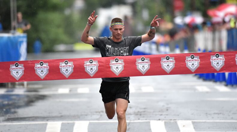 David Seymour with Team Army wins Kilometer Kids Charity Chase during the AJC Peachtree Road Race on Saturday, July 4, 2015. Kilometer Kids Charity Chase will feature six teams: Team Air Force, Team Army, Team Coast Guard, Team Marine Corps, Team National Guard and Team Navy. HYOSUB SHIN / HSHIN@AJC.COM