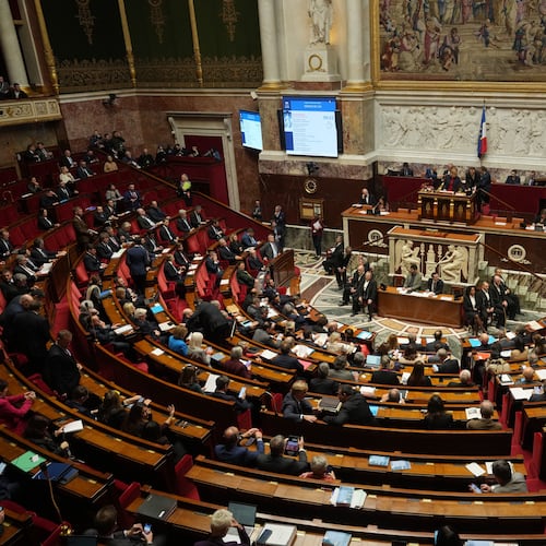Parliament members sit as France's National Assembly vote on a national health care budget that would suspend Macron's unpopular pension reform raising the retirement age, in Paris, France, Tuesday, Dec. 9, 2025. (AP Photo/Michel Euler)
