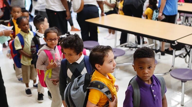 Community members as well as teachers greeted students as they returned to Hamilton E. Holmes Elementary School for the 2018-2019 school year.