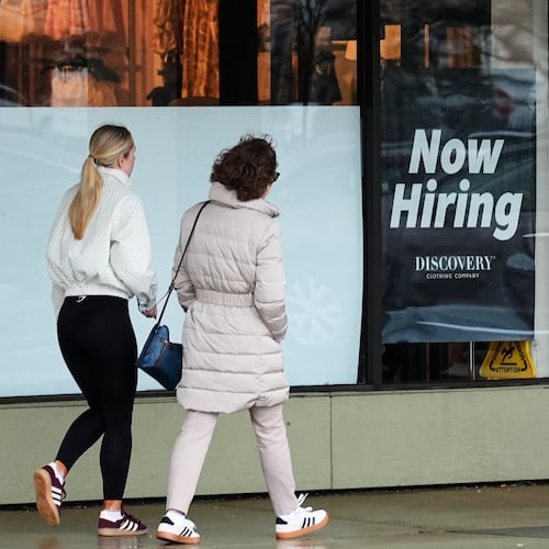 Now hiring sign is displayed at a retail store, in Arlington Heights, Ill., Thursday, April 2, 2026. (AP Photo/Nam Y. Huh)