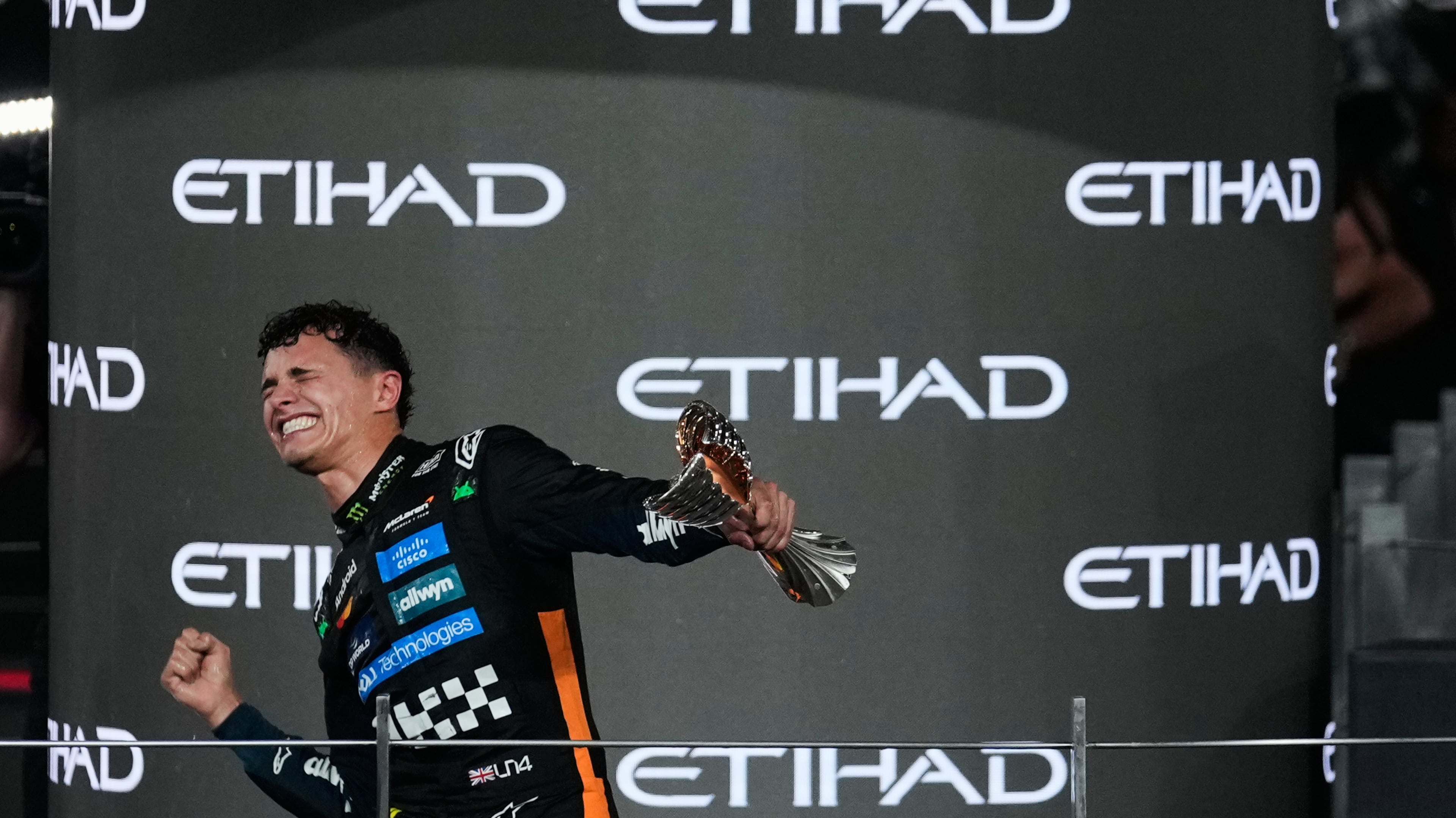 McLaren driver Lando Norris of Britain celebrates after becoming a world champion after the Formula One Abu Dhabi Grand Prix at the Yas Marina Circuit in Abu Dhabi, UAE, Sunday, Dec. 7, 2025. (AP Photo/Altaf Qadri)