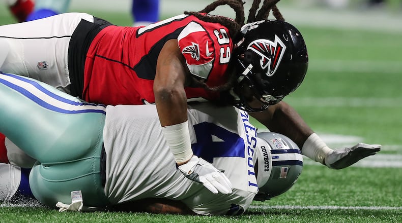 Falcons defensive end Adrian Clayborn records the fifth sack of Cowboys quarterback Dak Prescott during the second half in a NFL football game on Sunday, November 12, 2017, in Atlanta. The Falcons beat the Cowboys 27-7.   Curtis Compton/ccompton@ajc.com