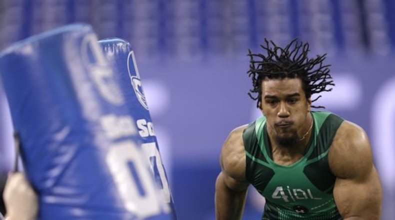 Clemson defensive lineman Vic Beasley runs a drill at the NFL football scouting combine in Indianapolis, Sunday, Feb. 22, 2015. (AP Photo/David J. Phillip)