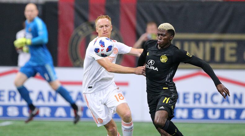 August 19, 2018 Atlanta: Atlanta United midfielder Jeff Larentowicz and Columbus Crew forward Gyasi Zardes battle for the ball during the second half in a MLS soccer match on Sunday, August 19, 2018, in Atlanta. Curtis Compton/ccompton@ajc.com