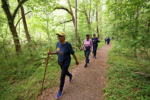 Members of the Nature Gurlz participate in their weekly morning walk along the trails at Cascade Springs Nature Preserve on April 22, 2025, in Atlanta. (Jason Getz/AJC)