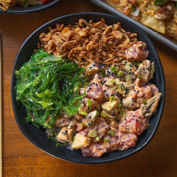 The Spicy Tuna Crunch Bowl at Nom Nom Poke Shop includes bigeye tuna, diced avocado, masago, seaweed salad, fried shallot and creamy togarashi. (Courtesy of Nom Nom Poke Shop)