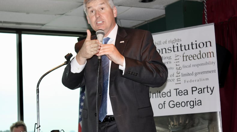 U.S. Rep. Rob Woodall, R-Ga., responds to questions at Thursday’s meeting with the United Tea Party of Georgia in Lawrenceville. Thursday, June 1, 2017. Woodall’s participation in the event was kept secret to keep away progressive critics. Like many members of Congress, Woodall has not scheduled any public town halls during the legislative break.